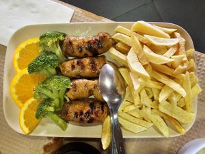 Veggie sausage with chips, rice, veggies and salad. at Restaurante Fojo dos Lobos in Fafiao