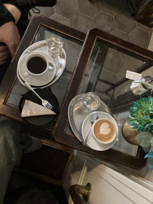 Coffee with oat milk & vegan carrot cake  at Aufzug Café in Vienna