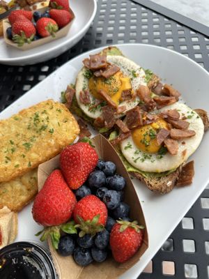 Avocado toast breakfast platter! Came with mango or orange juice.   at A Lo Vegano in Orlando
