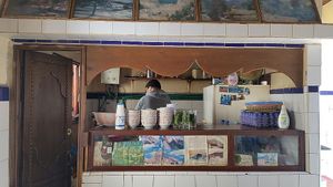 Behind the counter, the man is making your soup  at Baissara Ansara in Chefchaouen