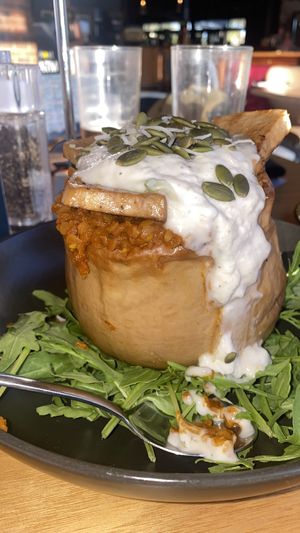 Delicious Smoked Stuffed Pumpkin, curried Dahl, spinach, tofu, coconut yogurt and or Peoria seeds  at Riverview Bar & Bistro  in Mannum