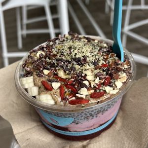 açaí, huckleberry, and chia seed pudding base with chocolate granola, almond butter, bananas, goji berries, cacao nibs, almonds, and hemp seeds  at Blue Bowl in San Diego