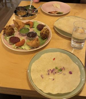 Sharing platter and popodom  at Namaste Village - Twickenham in Twickenham