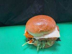 VTG Spicy Chicken Sandwich 

Crispy mock chicken patty (Contains soy, wheat gluten and wheat starch), 100% REAL Pepper jack cheese, Tomatoes, Lettuce and pickles and hot sauce.   at Vegetarian To Go in Decatur