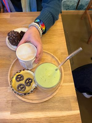 Matcha latte and other coffee drinks came with chocolate pretzel cookies. at Grignote in Pau