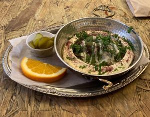 Hummus, mushroom, and onions (one of the only vegan dishes) at Mellow Yellow Coffee and Vibes in New York City