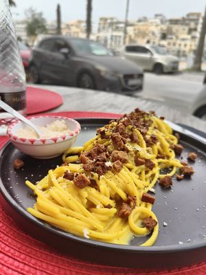 Vegan carbonara with extra Parmesan (vegan) at Arrassusia Bistrot in Wied Il-ghajn