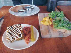Left front; chickpea frittata- right is avocado toast/tartine, left rear is buckwheat pancakes with jam. All yummy! at Happy Girl Kitchen in Pacific Grove