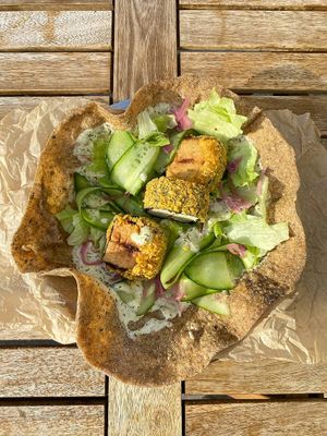 *FISH* GYROS 

Composition:
• whole grain pita
• misozuke tofu 
• fresh salad
• pickled onion at Lutra Lutra Bar in Tbilisi