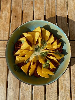 NACHOS WITH SOY MEAT 

Composition:
• spicy soy meat with tomato sauce 
• corn chips
• ayol sauce at Lutra Lutra Bar in Tbilisi