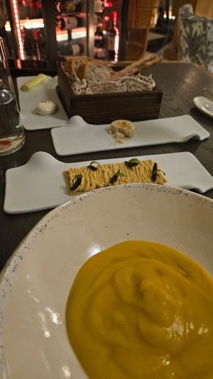 Chickpea soup and hummus cracker with olives at Bistrot 55 Classic Edition in Limassol