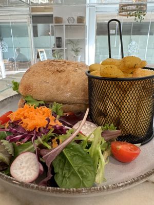 Vegan schnitzel burger with salad and fries   at The Garden Bakery - Online in Portimao