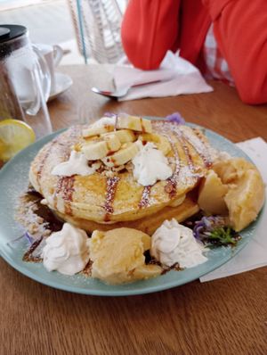 One portion of huge pancakes with banana, vegan ice cream cream and so much more.. at The Garden Bakery - Online in Portimao