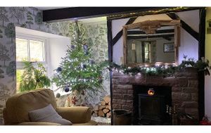 Our lounge with log fire  at Lane Head Farm Country Guest house  in Penrith
