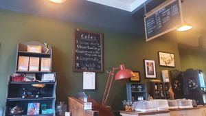 Cafe interior, showing the counter and the cake menu at The Kitchen Treasury in Kirkcaldy