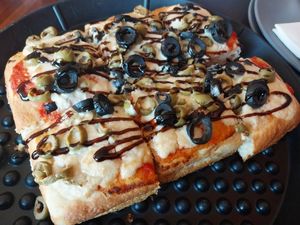cashew cheese, red sauce, black & green olives, and balsamic glaze at Pizza Payaa in Normal