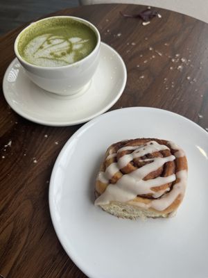 Cinnamon Roll and Matcha Tea  at Pip & Oat in Llandudno