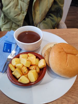 Seitan turkey & stuffing roll with fried potatoes and gravy at Pip & Oat in Llandudno