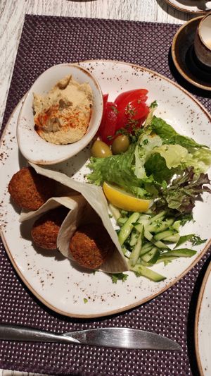 main: falafels with hummus and a salad at Vegafe - Totoriu g. in Vilnius