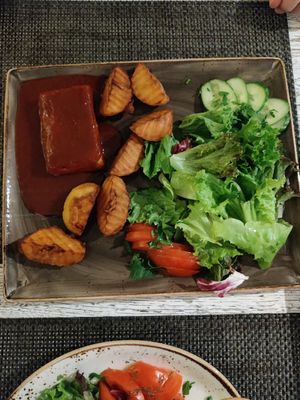 Tofu steak with potatoes and salad at Vegafe - Totoriu g. in Vilnius