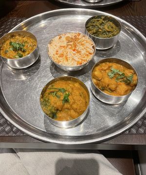 A set of 4 different curries (chickpeas, lentils, spinach, broccoli) €30 (minimum of 2 orders)- not clearly labelled but asked to veganise the 4 curry taste platter!  at Namaste Tandoori Leuven in Leuven