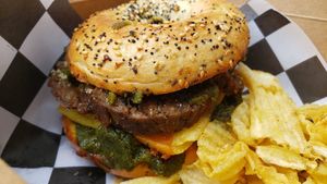 Sausage breakfast bagel ($17). Nice fresh pesto (no mayo, thank god). Good chipotle cheese. Excellent mushroom sausage. at Three Girls on Spring in Charleston