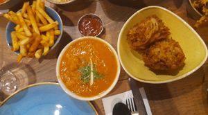 Onion bhajis and a not chicken curry. at Tap & Tandor in Portsmouth