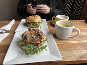 Delicious bagel special - locally made bagels with vegan cream cheese, tomato, onion and arugula   at Cafe Joust  in Catskill