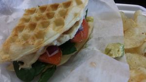 V club sandwich: avocado, spinach , red onion, tomato and hummus. at The Bald Strawberry Cafe in Indialantic
