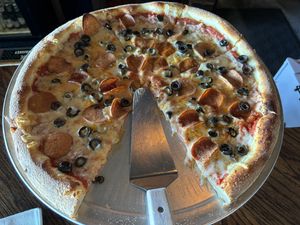 Vegan pizza with vegan pepperoni and black olives   at Damn Fine Pizza in Port Orchard