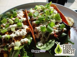 Raw Tacos!
Dehydrated organic red pepper and sweet corn wraps, topped with chili walnut ground, tomato and sweet corn salsa, smothered with house made cashew sour 'kream', green onions, and served with a lime! at The Food Forest in Peterborough