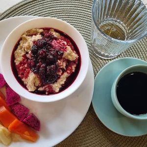 Oatmeal with plant milk of your choice, berry compote and fresh fruit at Phanguyana in Surat Thani