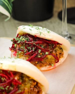 American Pulled Pork Baos made with pea protein pulled pork, with mayonnaise, sauerkraut, pickled beets, and mustard pickle relish at Shlen - Salamanca in Madrid