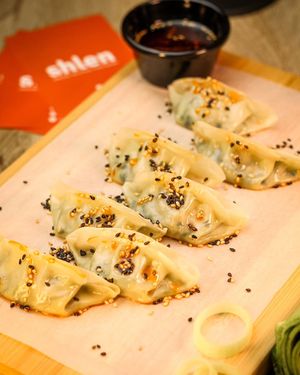 Leek gyozas with soy meat, toasted sesame, and sichuan pepper oil at Shlen - Salamanca in Madrid