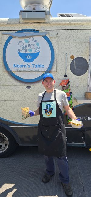 Noam bring out an order to a happy customer (me). at Noam's Table  in Cheyenne