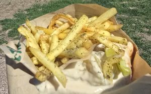 Falafel sandwich buried in Zatar fries at Noam's Table  in Cheyenne
