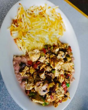 Vegan Tofu Veggie Scramble on beans with hash browns at Dinner Bell Cafe in Prescott