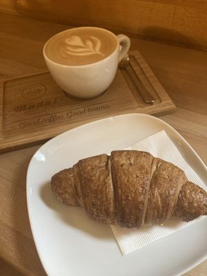 Oat latte and ginger and lemon vegan croissant  at Madal Cafe in Budapest