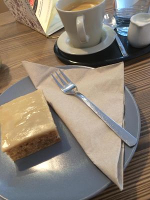 Lemon cake with maple glaze and a soy melange coffee at HappyCakes in Vienna