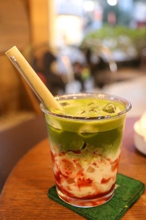 iced matcha with oat milk and strawberries at PhinHolic in Hue