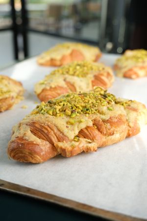 Vegan pistachio croissants with pistachio cream filling at The Artisan Baker in Cheltenham