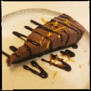 BEST CHEESCAKE EVER. Chocolat + orange…!! Had a food orgasm. 🥳  at Loving Vegan  in Hafnarfjordur