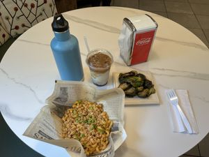 Chipotle Mac & cheese, Brussel sprouts, & an iced decaf almond milk hazelnut latte 😍  at Urban Deli in Savannah