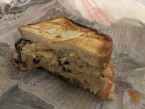 Vegan Chickpea “chicken” salad sandwich on toasted gluten free bread. Delicious  at Urban Deli in Savannah