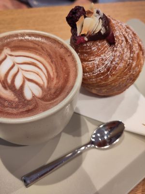Hot chocolate with pastry and jam inside at Elias Coffee Shop in Prague