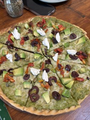 Vegan pizza with vegan cheese and vegan feta  at Greenr in Panaji