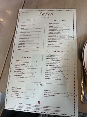 Marked up menu of all the ways it can be veganized!  at Safta in Denver