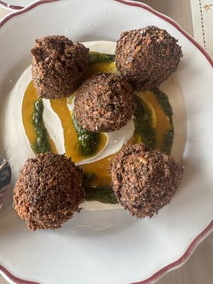 Falafel with tahini, zhoug, and amba sauce  at Safta in Denver