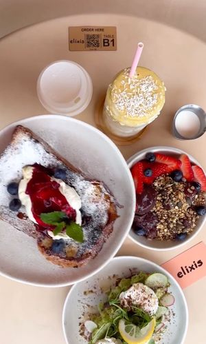 Brunch spread - creme brûlée brioche French toast, smashed avocado, golden glow smoothie, yoghurt and granola bowl at elixis  in South West London