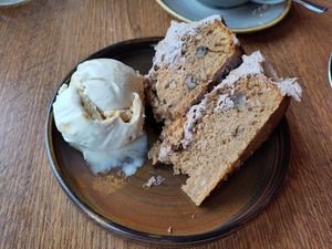 Coffee & walnut cake with a side of ice cream at Vegivores  in Bournemouth